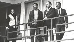 Dr Martin luther King stands on the balcony of the Memphis hotel